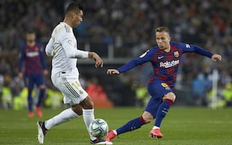 Carlos Henrique Casemiro of Real Madrid and Arthur Melo of FC Barcelona  during the La Liga match, date 26, between Real Madrid and FC Barcelona at Santiago Bernabeu Stadium on March 1, 2020 in Madrid, Spain.