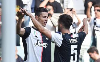 Juventus Cristiano Ronaldo jubilates with his teammate Miralem Pjanic after scoring the goal (2-0) during the italian Serie A soccer match Juventus FC vs S.P.A.L at Allianz stadium in Turin, Italy, 28 september 2019  ANSA/ ALESSANDRO DI MARCO