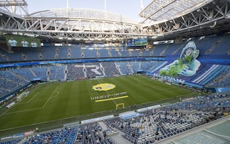 epa08511056 View of semi-empty Gazprom arena during the Russian Premier League soccer match between Zenit St. Petersburg and  Krylia Sovetov Samara in St. Petersburg, Russia, 26 June 2020. Russian Soccer Premier League restarts matches after a lockdown caused by coronavirus pandemic with limited quantity of fans.  EPA/ANATOLY MALTSEV