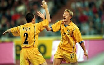23 Aug 2000:  Scorer Alan Smith of Leeds celebrates his goal with Gary Kellyduring the match between 1860 Munich and Leeds United in the UEFA Champions League Third Qualifying Round, Second Leg at the Olympic Stadium, Munich, Germany. Mandatory Credit: Clive Brunskill/ALLSPORT