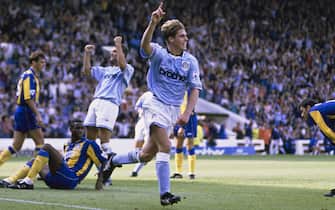 MANCHESTER, ENGLAND - AUGUST 14: City player Gary Flitcroft celebrates after scoring in a 1-1 draw FA Premier League match with Leeds United as Leeds players David O' Leary, Chris Fairclough (floor) and Gary Speed (r) react at Maine Road on August 14, 1993 in Manchester, United Kingdom. (Photo by Steve Munday/Allsport/Getty Images/Hulton Archive)