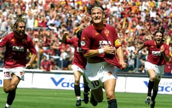 ROME, ITALY:  AS Roma's captain Francesco Totti jubilates after scoring the first goal against Parma during the last day of the First Italian League at Rome's Olympic Stadium, 17 June 2001.    AFP PHOTO GABRIEL BOUYS (Photo credit should read GABRIEL BOUYS/AFP/Getty Images)