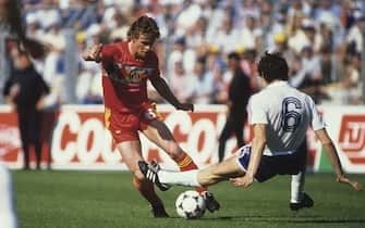 NANTES, FRANCE - JUNE 16: Frank Vercauteren of Belgium is challenged by Luis Fernandez of France during the UEFA European Championships 1984 Group 1 match between France and Belgium held on June 16, 1984 at the La Beaujoire in Nantes, France. (Photo by Getty Images)