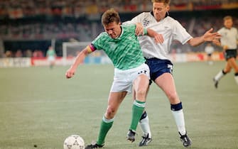 TURIN, ITALY - JULY 04: England winger Chris Waddle (r) challenges West Germany captain Lothar MatthÃ¤us during the 1990 FIFA World Cup Semi Final at Stadio delle Alpi on July 4th, 1990 in Turin, Italy.  (Photo by Simon Bruty/Allsport/Getty Images)