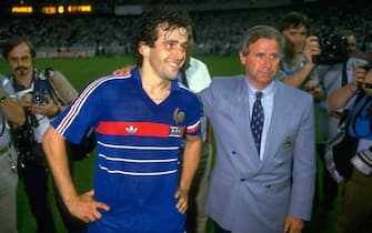 27 Jun 1984:  Michel Platini of France with coach Michel Hidalgo after victory in the European Championship Final against Spain at Parc des Princes in Paris. France won the match 2-0. \ Mandatory Credit: David Cannon /Allsport