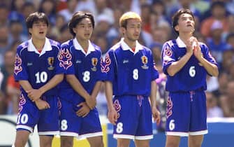 NANTES, FRANCE:  Japanese players Hiroshi Nanami, Shoji Jo, Hidetoshi Nakata and Motohiro Yamaguchi (from L to R) stand next to each other to form a wall as a  Croatian player prepares to shoot a free kick, 20 June at the La Beaujoire stadium in Nantes, during the 1998 Soccer World Cup group H match between Croatia and Japan. Croatia beat Japan 1-0. (ELECTRONIC IMAGE). (Photo credit should read JACQUES DEMARTHON/AFP via Getty Images)