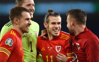 epa08010045 (from left) Aaron Ramsey, goalkeeper Wayne Hennessey, Gareth Bale and Chris Gunter of Wales celebrate after the UEFA EURO 2020 Group E qualification match between Wales and Hungary in Cardiff, Wales, Britain, 19 November 2019. Wales won 2-0.  EPA/PETER POWELL