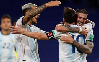 epa08730787 Lionel Messi (C) of Argentina celebrates after scoring during the South American qualifiers for the Qatar 2022 World Cup between the national soccer teams of Argentina and Ecuador, at La Bombonera stadium in Buenos Aires, Argentina, 08 October 2020.  EPA/AGUSTIN MARCARIAN POOL