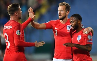 epa07921174 Raheem Sterling (R) of England celebrates after scoring with his teammates Harry Kane (C) and Jordan Henderson (L) during the UEFA EURO 2020 qualifying group A soccer match between Bulgaria and England at Vassil Levski stadium in Sofia, Bulgaria, 14 October 2019.  EPA/GEORGI LICOVSKI