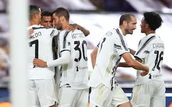 Cristiano Ronaldo of Juventus celebrates with his teammates after scoring 2-2 goal during the italian Serie A soccer match between AS Roma and FC Juventus at Olimpico Stadium in Rome, Italy, 26 Semptember 2020. ANSA/FEDERICO PROIETTI