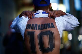 OLIVOS, ARGENTINA - NOVEMBER 03: A fan of Diego Maradona shows a tattoo on November 03, 2020 in Olivos, Argentina. Personal doctor of Maradona, Leopoldo Luque, confirmed the former footballer will under a surgery to treat a clot in his brain. Maradona, who turned 60 on Friday 30, had spent the night of Monday hospitalized after being admitted with symptoms of depression. (Photo by Marcos Brindicci/Getty Images)