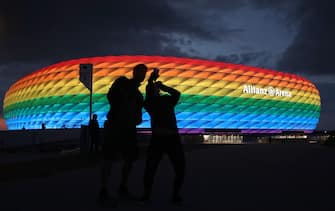 MUNICH, GERMANY - JULY 11: A general view outside of the soccer stadium Allianz Arena which is illuminated in rainbow colours for Christopher Street Day (CSD) on July 11, 2020 in Munich, Germany. Christopher Street Day is an annual European LGBT celebration and demonstration held in various cities across Europe for the rights of LGBT people and against discrimination and exclusion. (Photo by Alexander Hassenstein/Getty Images)