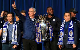 File photo dated 16-05-2016 of Leicester City vice-chairman Aiyawatt Srivaddhanaprabha, manager Claudio Ranieri (centre left), captain Wes Morgan (second right) and chairman Vichai Srivaddhanaprabha (right) celebrate with the Barclays Premier League trophy on stage at Victoria Park