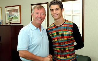 MANCHESTER, ENGLAND - AUGUST 12:  Sir Alex Ferguson greets Cristiano Ronaldo as the young Portugese player signs for Manchester united at the Carrington Training Ground, Carrington on August 12, 2003 in Manchester, England.  (Photo by John Peters/Manchester United via Getty Images)