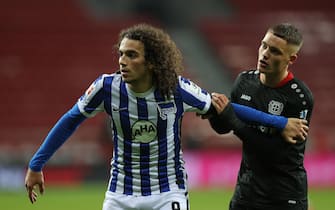 epa08852337 Matteo Guendouzi of Berlin (L) in action against Florian Wirtz of Leverkusen during the German Bundesliga soccer match between Bayer 04 Leverkusen and Hertha BSC in Leverkusen, Germany, 29 November 2020.  EPA/Lars Baron / POOL ATTENTION:  The DFL regulations prohibit any use of photographs as image sequences and/or quasi-video.