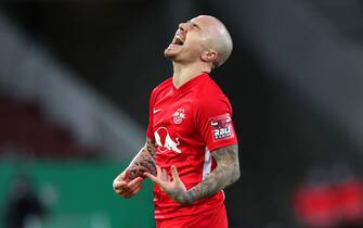 epa08900063 Angelino of RB Leipzig celebrates after scoring their sides third goal during the DFB Cup second round match between FC Augsburg and RB Leipzig at WWK-Arena in Augsburg, Germany, 22 December 2020.  EPA/ALEXANDER HASSENSTEIN / POOL DFL regulations prohibit any use of photographs as image sequences and/or quasi-video.