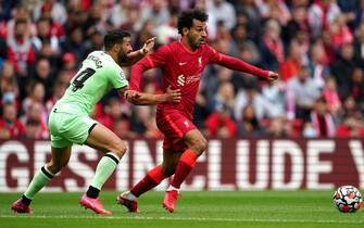 Liverpool's Mohamed Salah (right) and Athletic Bilbao's Mikel Balenziaga battle for the ball during the Pre-Season Friendly match at Anfield, Liverpool. Picture date: Sunday August 8, 2021.