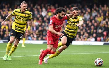WATFORD, ENGLAND - OCTOBER 16: Mohamed Salah of Liverpool takes on Craig Cathcart of Watford on his way to scoring the 4th Liverpool goal during the Premier League match between Watford and Liverpool at Vicarage Road on October 16, 2021 in Watford, England. (Photo by Justin Setterfield/Getty Images)