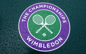 epa08513898 Detail of a wet Wimbledon logo at the All England Lawn Tennis Club on a stormy Saturday 27th June 2020 the weekend before The Championships were due to start on Monday 29th June 2020. The grounds are quiet and still, normally they would be busy and bustling with players practising and groundsmen and staff making the final detailed preparations. The Championships have been cancelled due to the Coronavirus pandemic.  EPA/AELTC/Bob Martin HANDOUT  HANDOUT EDITORIAL USE ONLY/NO SALES