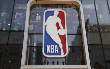 epa08288213 (FILE) - A view shows an NBA logo outside a store in Beijing, China, 09 October 2019. Utah Jazz center Rudy Gobert tested positive for COVID-19 it was announced 11 March 2020. The test result was announced just before tip-off of the Utah Jazz and Oklahoma City Thunder game at Chesapeake Bay Arena in Oklahoma City. The game was called off and shortly thereafter the National Basketball Association (NBA) announced the suspension of the 2020 season.  EPA/WU HONG *** Local Caption *** 55533593