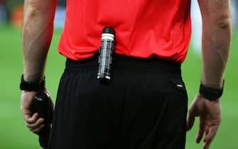 epa05367978 An assistant referee carries a can of vanishing spray during the UEFA EURO 2016 group A preliminary round match between France and Albania at Stade Velodrome in Marseille, France, 15 June 2016.(RESTRICTIONS APPLY: For editorial news reporting purposes only. Not used for commercial or marketing purposes without prior written approval of UEFA. Images must appear as still images and must not emulate match action video footage. Photographs published in online publications (whether via the Internet or otherwise) shall have an interval of at least 20 seconds between the posting.)  EPA/OLIVER WEIKEN   EDITORIAL USE ONLY