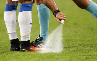 epa05366954 The referee uses vanishing spray at a free-kick during the UEFA EURO 2016 group B preliminary round match between Russia and Slovakia at Stade Pierre Mauroy in Lille, France, 15 June 2016.(RESTRICTIONS APPLY: For editorial news reporting purposes only. Not used for commercial or marketing purposes without prior written approval of UEFA. Images must appear as still images and must not emulate match action video footage. Photographs published in online publications (whether via the Internet or otherwise) shall have an interval of at least 20 seconds between the posting.)  EPA/LAURENT DUBRULE   EDITORIAL USE ONLY