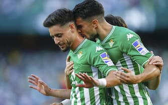 Alex Moreno of Real Betis celebrate his goal with Marc Bartra during the La Liga match between Real Betis and Rayo Vallecano played at Benito Villamarin Stadium on October 24, 2021 in Sevilla, Spain. (Photo by Antonio Pozo / PRESSINPHOTO)
