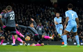 Manchester City's Riyad Mahrez (second right) shoots towards goal during the Premier League match at The Etihad Stadium, Manchester. Picture date: Sunday December 26, 2021.
