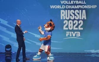 epa09497930 The general manager of the Russian national volleyball team Sergei Tetyukhin reacts with Siberian tiger, the official mascot of the 2022 FIVB Volleyball Men's World Championship during the draw ceremony of the 2022 FIVB Volleyball Men's World Championship in Moscow, Russia, 30 September 2021. The FIVB 2022 Volleyball World Championship takes place in Russia from 26 August to 11 September 2022. World Cup matches will be held in ten Russian cities: Moscow, St. Petersburg, Kaliningrad, Yaroslavl, Kazan, Ufa, Yekaterinburg, Novosibirsk, Kemerovo and Krasnoyarsk.  EPA/Yuri Kochetkov  EPA-EFE/Yuri Kochetkov