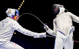 TOPSHOT - (L-R) US Miles Chamley-Watson (L) and Italian Alessio Voconi vie during the team men's foil final between USA and Italy at the World Fencing Championships on July 26, 2017 in Leipzig. / AFP PHOTO / ROBERT MICHAEL        (Photo credit should read ROBERT MICHAEL/AFP via Getty Images)