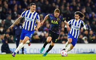 Brighton and Hove Albion's Lewis Dunk, Tottenham Hotspur's Dejan Kulusevski, and Brighton and Hove Albion's Marc Cucurella (left-right) battle for the ball during the Premier League match at the AMEX Stadium, Brighton. Picture date: Wednesday March 16, 2022.