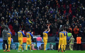 Apoel players applaud their supporters after the UEFA Champions League Group H football match between Tottenham Hotspur and Apoel Nicosia at Wembley Stadium in London, on December 6, 2017.
Tottenham won the game 3-0. / AFP PHOTO / Ben STANSALL        (Photo credit should read BEN STANSALL/AFP via Getty Images)