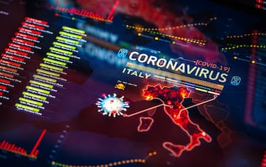 Coronavirus (COVID-19) Outbreak in Italy Statistics close-up on digital display. Quarantine map.