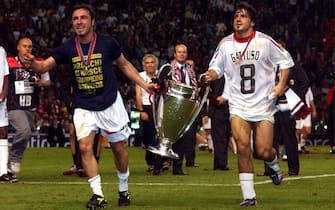 AC Milan's Cristian Brocchi (l) and teammate Gennaro Gattuso celebrate with the UEFA Champions League trophy  (Photo by Neal Simpson/EMPICS via Getty Images)
