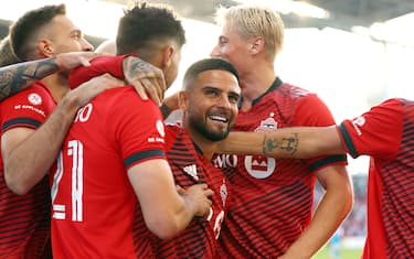 TORONTO, ON - JULY 23:  Jonathan Osorio #21 of Toronto FC celebrates a goal with Lorenzo Insigne (C) #24 and teammates in an MLS game against Charlotte FC at BMO Field on July 23, 2022 in Toronto, Ontario, Canada.  (Photo by Vaughn Ridley/Getty Images)