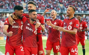 TORONTO, ON - JULY 23:  Jonathan Osorio #21 (L) of Toronto FC celebrates a goal with Lorenzo Insigne #24, Jesus Jimenez #9, Federico Bernardeschi #10 and Domenico Criscito #44 in an MLS game against Charlotte FC at BMO Field on July 23, 2022 in Toronto, Ontario, Canada.  (Photo by Vaughn Ridley/Getty Images)