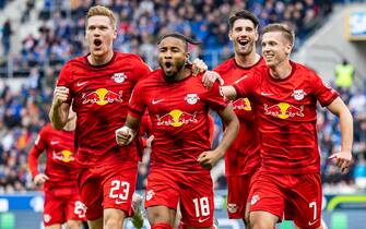 05 November 2022, Baden-Wuerttemberg, Sinsheim: Soccer: Bundesliga, TSG 1899 Hoffenheim - RB Leipzig, Matchday 13, PreZero Arena. Leipzig's Christopher Nkunku (2nd from left) celebrates after his goal to make it 0:1 with Leipzig's Marcel Halstenberg (l-r), Leipzig's Dominik Szoboszlai and Leipzig's Daniel Olmo Carvajal. Photo: Tom Weller/dpa - IMPORTANT NOTE: In accordance with the requirements of the DFL Deutsche Fußball Liga and the DFB Deutscher Fußball-Bund, it is prohibited to use or have used photographs taken in the stadium and/or of the match in the form of sequence pictures and/or video-like photo series.