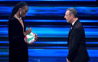 Italian Volleyball player Paola Ogechi Egonu with Sanremo Festival host and artistic director Amadeus (R) on stage at the Ariston theatre during the 73rd Sanremo Italian Song Festival, in Sanremo, Italy, 07 February 2023. The music festival will run from 07 to 11 February 2023.  ANSA/ETTORE FERRARI
