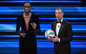 Sanremo Festival host and artistic director Amadeus (R) with Italian Volleyball player Paola Ogechi Egonu (L) on stage at the Ariston theatre during the 73rd Sanremo Italian Song Festival, in Sanremo, Italy, 09 February 2023. The music festival will run from 07 to 11 February 2023.  ANSA/ETTORE FERRARI
