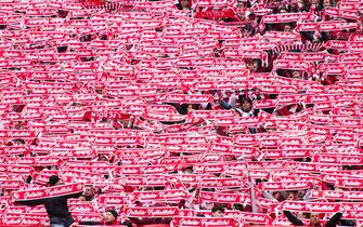 02 April 2023, North Rhine-Westphalia, Cologne: Soccer, Bundesliga, 1. FC Köln - Borussia Mönchengladbach, Matchday 26, RheinEnergieStadion. Cologne fans hold their fan scarves with the inscription "Geliebter Fußballclub. Photo: Marius Becker/dpa - IMPORTANT NOTE: In accordance with the requirements of the DFL Deutsche Fußball Liga and the DFB Deutscher Fußball-Bund, it is prohibited to use or have used photographs taken in the stadium and/or of the match in the form of sequence pictures and/or video-like photo series.