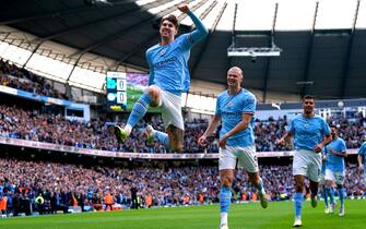 Manchester City's John Stones (left) celebrates scoring their side's first goal of the game with team-mates during the Premier League match at the Etihad Stadium, Manchester. Picture date: Saturday April 15, 2023. See PA story SOCCER Man City. Photo credit should read: Nick Potts/PA Wire. RESTRICTIONS: EDITORIAL USE ONLY No use with unauthorised audio, video, data, fixture lists, club/league logos or "live" services. Online in-match use limited to 120 images, no video emulation. No use in betting, games or single club/league/player publications.