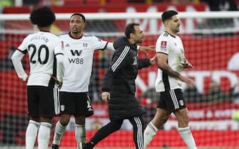 Manchester United v Fulham, FA Cup, Quarter Final. Referee Chris Kavanagh sends off both Aleksandar Mitrovic and Willian of Fulham after he checked VAR for handball by Willian and Mitovic for approaching referee. 19.03.2023 

Material must be credited "The Times/News Licensing" unless otherwise agreed. 100% surcharge if not credited. Online rights need to be cleared separately. Strictly one time use only subject to agreement with News Licensing