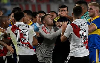Players of both teams scuffle after incidents following River Plate's penalty goal during the Argentine Professional Football League Tournament 2023 match between River Plate and Boca Juniors at El Monumental stadium in Buenos Aires on May 7, 2023. (Photo by Luis ROBAYO / AFP) (Photo by LUIS ROBAYO/AFP via Getty Images)