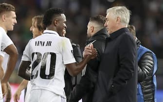 epa10461946 Real Madrid's coach Carlo Ancelotti (R) greets Vinicius Junior (L) of Real Madrid after winning the FIFA Club World Cup final between Real Madrid and Al Hilal SFC in Rabat, Morocco, 11 February 2023.  EPA/Mohamed Messara