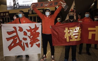 WUHAN, CHINA - APRIL 18:(CHINA OUT) Supporters of Wuhan Zall football team welcome the team when they arrive arrive at Wuhan railway station on April 18, 2020 in Hubei, China. The Wuhan Zall football team left Wuhan on January 5, 2020 for a training session in Guangzhou of Guangdong Province. Since then the team has spent 104 days training in Malaga, Spain and other cities in Guangdong before finally returning to Wuhan on Saturday, finishing a prolonged journey during the Coronavirus (COVID-19) pandemic.(Photo by Getty Images)