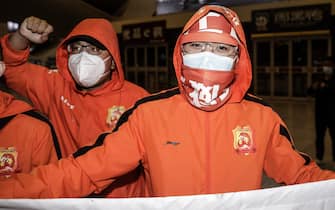 WUHAN, CHINA - APRIL 18: (CHINA OUT) Supporters of Wuhan Zall football team welcome the team when they arrive at Wuhan railway station on April 18, 2020 in Hubei, China. The Wuhan Zall football team left Wuhan on January 5, 2020 for a training session in Guangzhou of Guangdong Province. Since then the team has spent 104 days training in Malaga, Spain and other cities in Guangdong before finally returning to Wuhan on Saturday, finishing a prolonged journey during the Coronavirus (COVID-19) pandemic.(Photo by Getty Images)