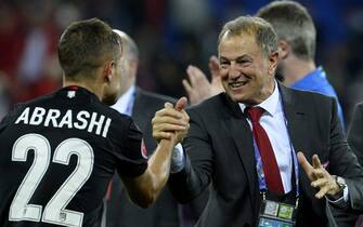 epa05378314 Albania's head coach Gianni De Biasi (R) celebrates winning the UEFA EURO 2016 group A preliminary round match between Romania and Albania at Stade de Lyon in Lyon, France, 19 June 2016.(RESTRICTIONS APPLY: For editorial news reporting purposes only. Not used for commercial or marketing purposes without prior written approval of UEFA. Images must appear as still images and must not emulate match action video footage. Photographs published in online publications (whether via the Internet or otherwise) shall have an interval of at least 20 seconds between the posting.)  EPA/CJ GUNTHER   EDITORIAL USE ONLY