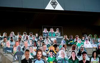 Cardboard cut-outs with portraits of Borussia Moenchegladbach's supporters are seen at the Borussia Park football stadium in Moenchengladbach, western Germany, on April 16, 2020, amid the novel coronavirus COVID-19 pandemic. - Large-scale public events such as football matches will remain banned in Germany until August 31 due to the coronavirus crisis, Berlin said on Wednesday, April 15, 2020, though it did not rule out allowing Bundesliga games to continue behind closed doors. (Photo by Ina FASSBENDER / AFP) (Photo by INA FASSBENDER/AFP via Getty Images)