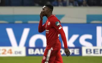 epa08022696 Ridle Baku of Mainz leaves the pitch after getting a red card during the German Bundesliga soccer match between TSG 1899 Hoffenheim and FSV Mainz 05 in Sinsheim, Germany, 24 November 2019.  EPA/RONALD WITTEK CONDITIONS - ATTENTION: The DFL regulations prohibit any use of photographs as image sequences and/or quasi-video.