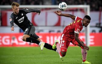 epaselect epa07982243 Hoffenheim's Stefan Posch (L) in action against Cologne's Jhon Cordoba (R) during the German Bundesliga soccer match between 1. FC Koeln and TSG 1899 Hoffenheim in Cologne, Germany, 08 November 2019.  EPA/SASCHA STEINBACH CONDITIONS - ATTENTION: The DFL regulations prohibit any use of photographs as image sequences and/or quasi-video.